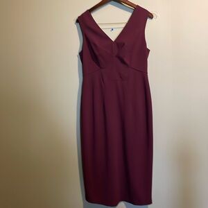 Mid length plum V neck sheath dress with gorgeous full length zipper detail.